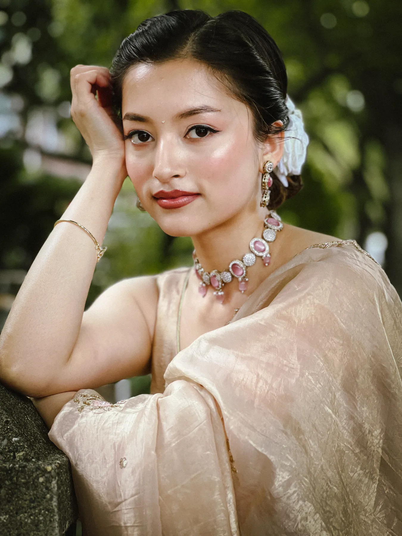 Diya Shrestha in a beige sari and jewellery