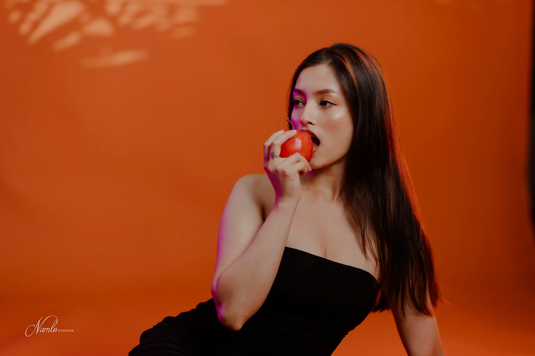 Diya Shrestha with a red apple